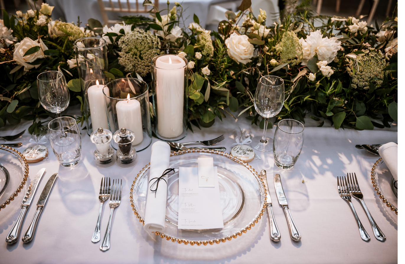 Table detail with foliage runner and candles, Lincolnshire wedding