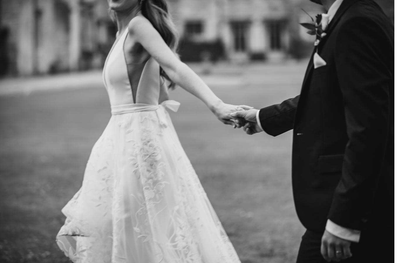 Candid black and white portrait of the couple, Joe and Charlotte's orangery wedding in Lincolnshire