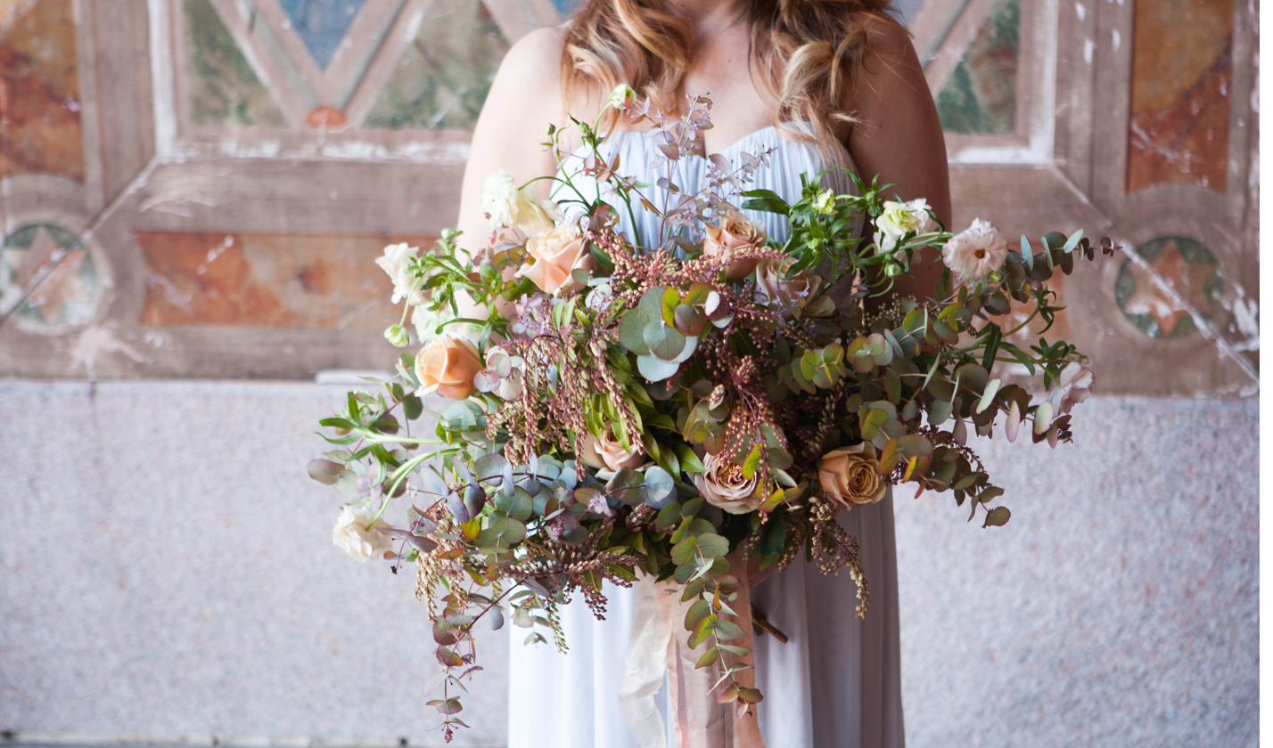 Wild and natural bridal bouquet at a village church, Lincolnshire wedding