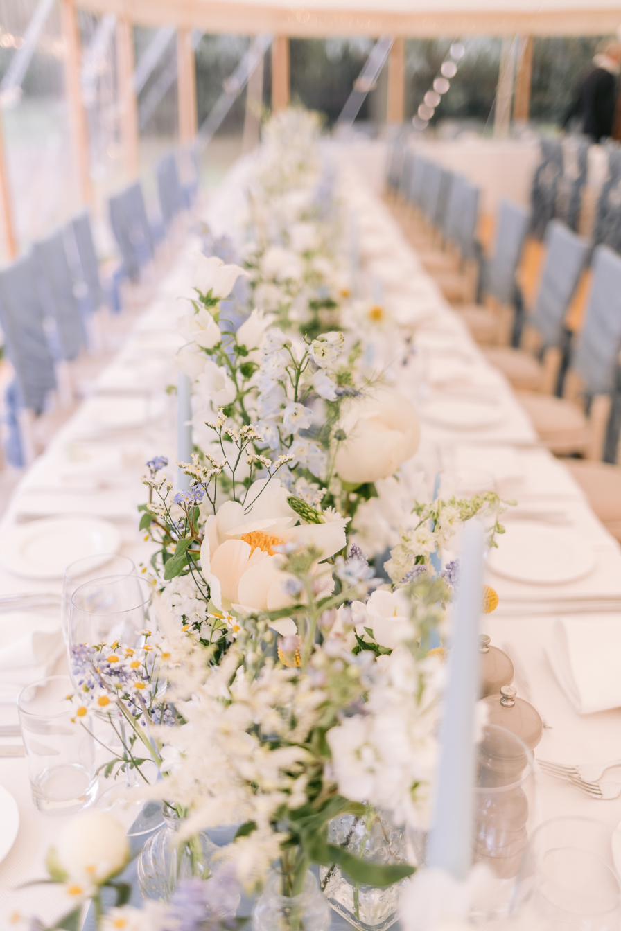 Marquee long tables with meadow style flowers, Lucia and Alex's marquee wedding in Rutland