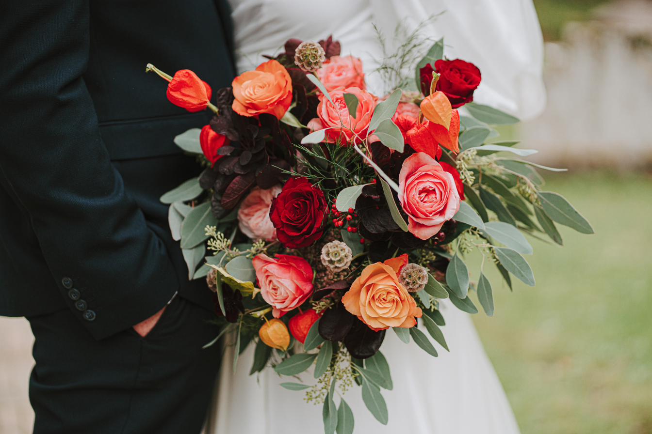 Coral, red and burgundy bridal bouquet, Lincolnshire wedding