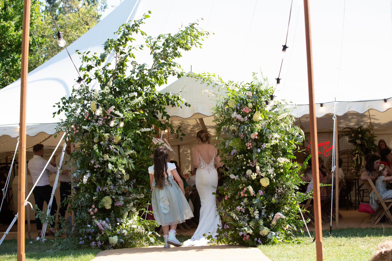 Floral marquee entrance arch at a Rutland wedding