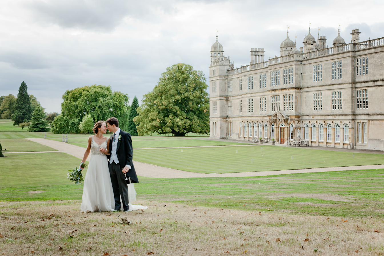 Couple on the lawn at Burghley House, Stamford wedding