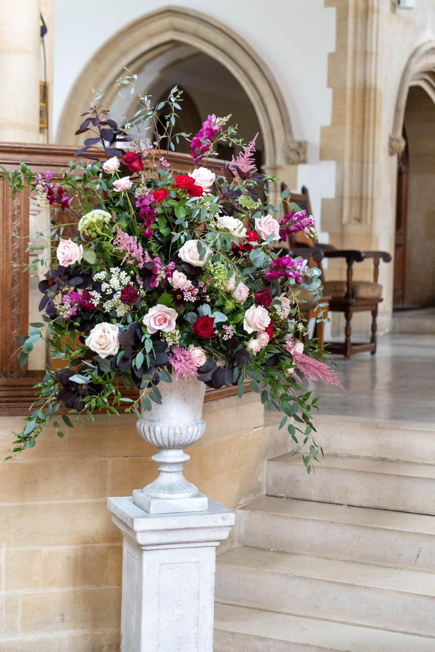 Urn pedestal arrangement at a stately home, Rutland wedding